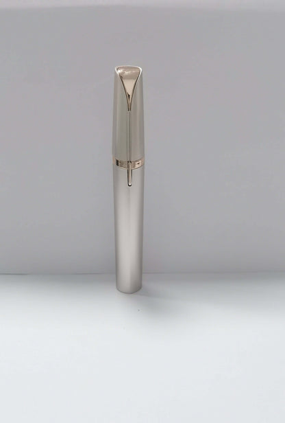 LED eyebrow trimmer with 18K gold-plated head for painless shaping