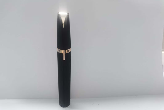 LED eyebrow trimmer with 18K gold-plated head for painless shaping